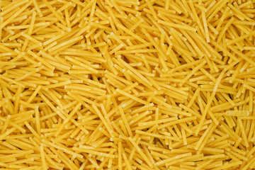 small pasta texture background closeup. vermicelli.  raw small noodles