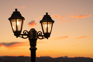 Fototapeta na wymiar Street lantern at sunset on Corfu island, Greece
