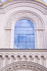Obraz premium Close up of window on church. Old window on ancient Christian orthodox cathedral. Blue sky in window. Architecture exterior with windows