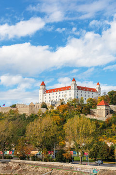 bratislava castle on the hill. beautiful travel destination of slovakia. sunny autumn weather with fluffy clouds on the sky