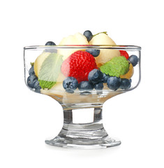 Bowl of tasty fruit salad on white background