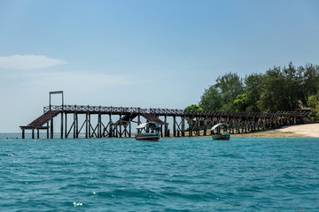 Fototapeta na wymiar Wooden pier over blue ocean