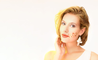 lifestyle woman posing on white background with white dress showing emotions