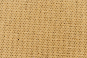 brown fiberboard wall texture background closeup