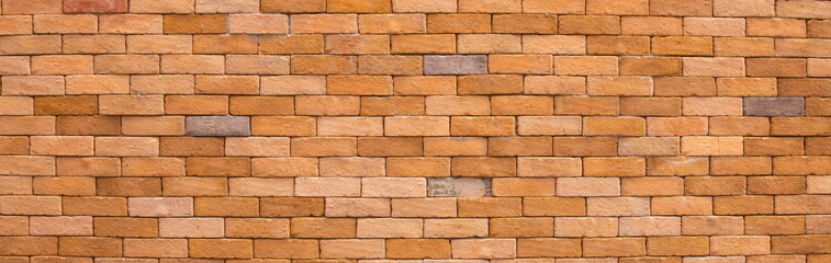 Abstract panorama image of Orange grunge brick wall texture background.