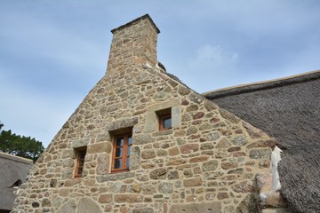 Fototapeta na wymiar Pignon de pierres en granit de Bretagne. France