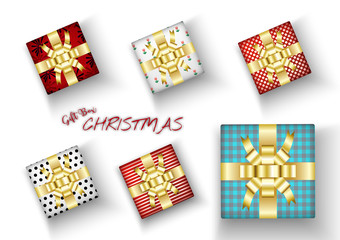 Fototapeta premium Set of Merry Christmas realistic gift box with bright wrapping and golden bow