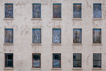 Boarded up windows from an abandoned building