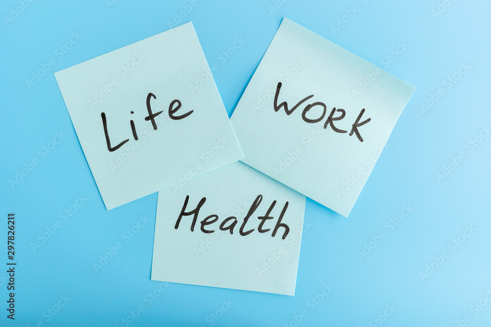 Wall mural Lifework and health balance concept. Stickers with life, work and balance caption on a blue background