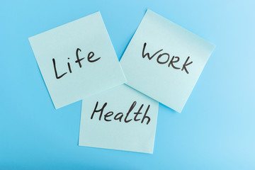 Lifework and health balance concept. Stickers with life, work and balance caption on a blue...