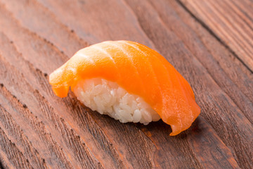 Sushi on the wooden table. Closeup of delicious japanese food with sushi roll.