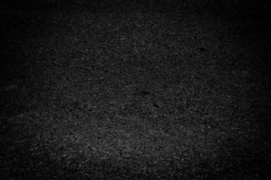 black asphalt texture background. dark tone.