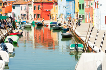 Fototapeta na wymiar Tourists visiting the old Colorful city Burano - Italy.