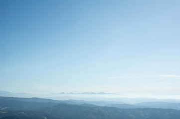 Horizon with Slovakian mountains (Mala Fatra) in the distance. Clear blue sky during sunny weather as very large copy space area. Nature and good visibility.