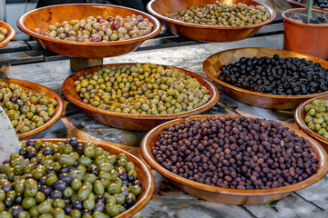 .Pickled olives at a farmers market.