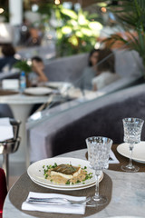 Pan Fried Black Cod with Creamy Fennel as Side Dish. Lunch Served in Restaurant.