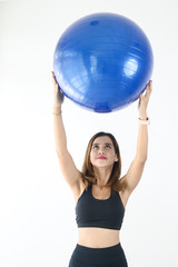 Fototapeta premium Asian sport woman holding blue ball pilates, lifestyle concept.