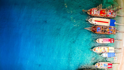 Colorful nautical boats with tourists top view, copy space