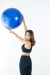 Asian sport woman holding blue ball pilates, lifestyle concept.