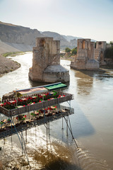 Panoramic view of the Old Tigris Bridge, Castle and minaret in the city of Hasankeyf, Turkey....