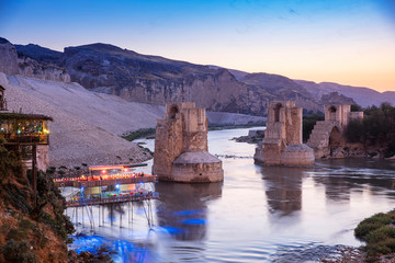 Panoramic view of the Old Tigris Bridge, Castle and minaret in the city of Hasankeyf, Turkey....