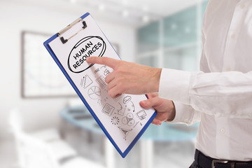 Business, technology, internet and network concept. Young businessman points to the keyword: Human...