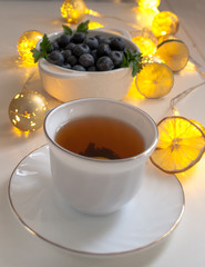tea with berries and lanterns