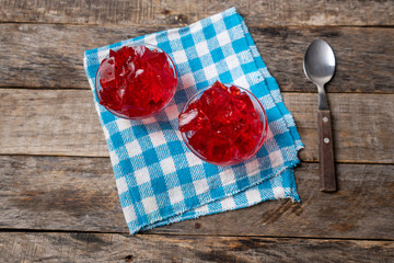 Red jelly on wooden background