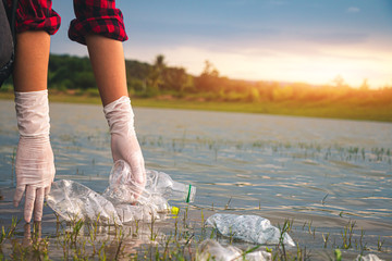 Women volunteer help garbage collection for to recycling and the campaign to stop using plastic to reduce global warming.