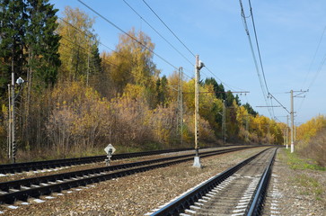 Fototapeta na wymiar Railway in autumn Sunny day