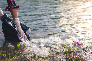 Women volunteer help garbage collection for to recycling and the campaign to stop using plastic to...