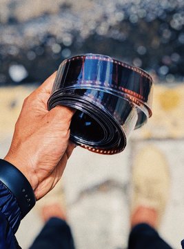 Man holding film negative roll