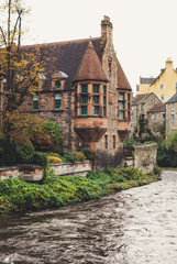Fototapeta na wymiar Scottish houses in the fall on the river