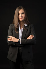 young beautiful brunette girl black background, portrait, straight long dark hair, black jacket, white blouse