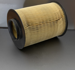 Cylinder shaped air filter made of paper.