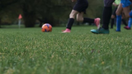 Girls playing soccer match