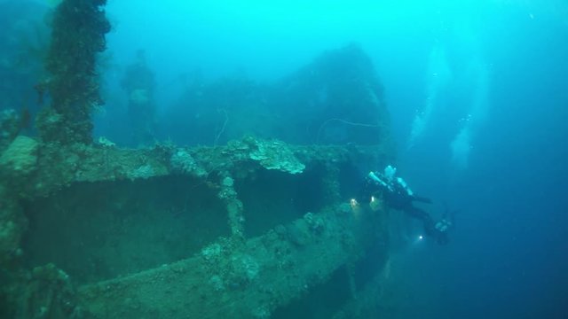 Wreck underwater in Truk Lagoon on Chuuk Islands. Shipwreck in historic place of terrible tragedy of WW II. Rust, metal corrosion and corals and diving among the wreckage of ship.