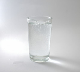 Transparent glass and bubbles on a white background