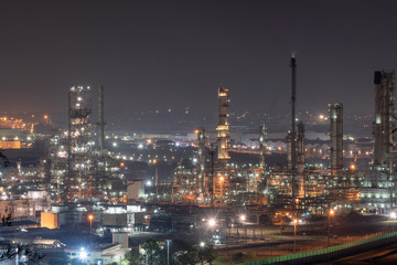 Fototapeta na wymiar Landscape of Oil and Gas Refinery Manufacturing Plant., Petrochemical or Chemical Distillation Process Buildings., Factory of Power and Energy Industrial at Twilight Sunset., Engineering Petroleum.