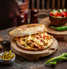 chicken doner with french fries vegetables and cheese