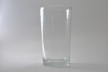 Transparent glass and bubbles on a white background