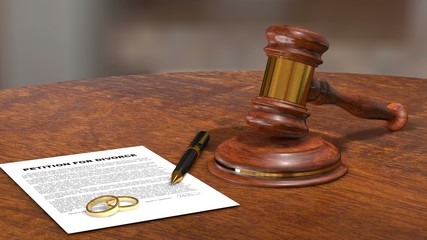 Petition for Divorce signed document with rings on judge table official break up