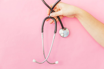 Simply minimal design woman hand holding medicine equipment stethoscope or phonendoscope isolated...