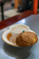 Traditional mexican bread - pan de muerto with hot chocolate served during Day of the Dead celebration, traditional Mexican breakfast