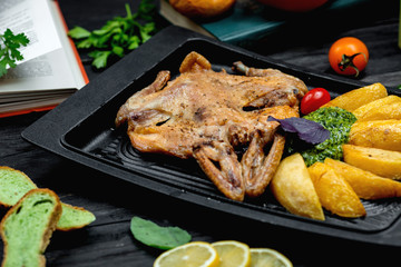 fried chicken with potatoes on board