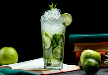 glass of mojito with lime, mint and ice