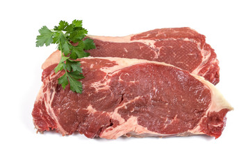 two raw steak on a white background