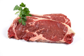 two raw steak on a white background