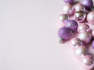 Christmas composition. Pink background and pink different Christmas ball. Copy space