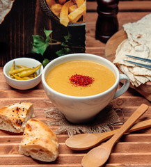 lentil soup with bread on the table 1